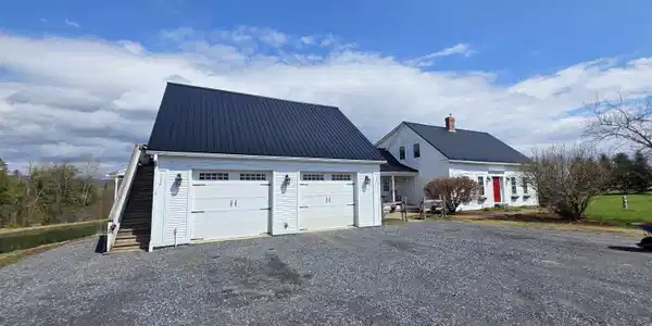 Image 2: Two car attached garage with apartment overhead