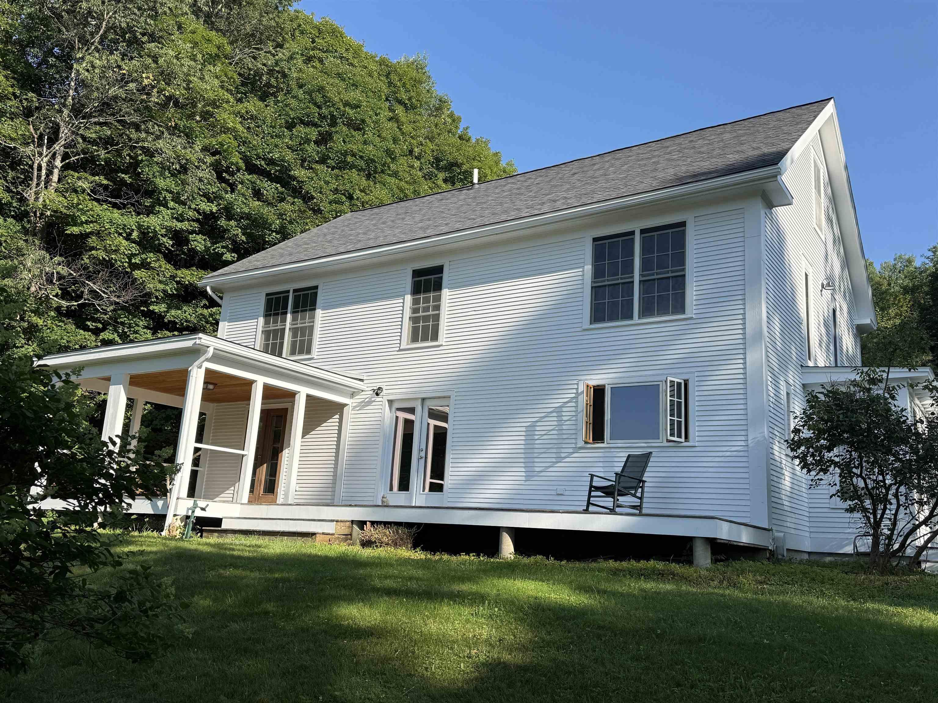 Image 3: COVERED PORCH AREA LOOKING OVER MEADOW