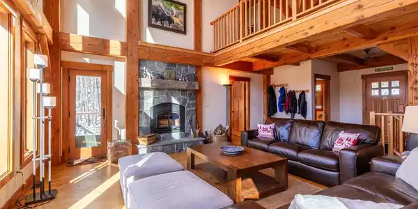 Image 4: Living room with cathedral ceiling