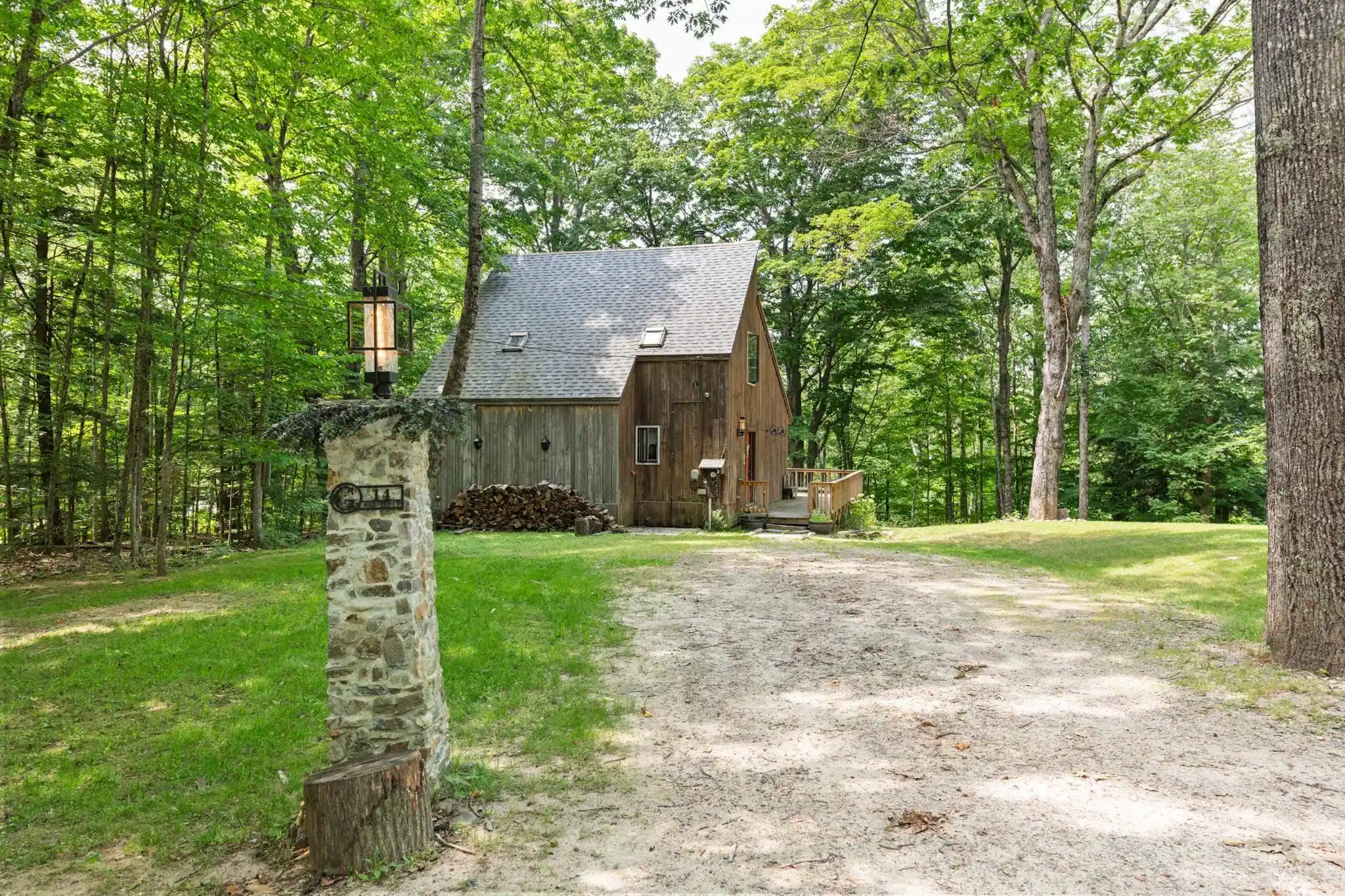 Image 1: This charming cottage is at the end of the road and tucked i Image 1: This charming cottage is at the end of the road and tucked i