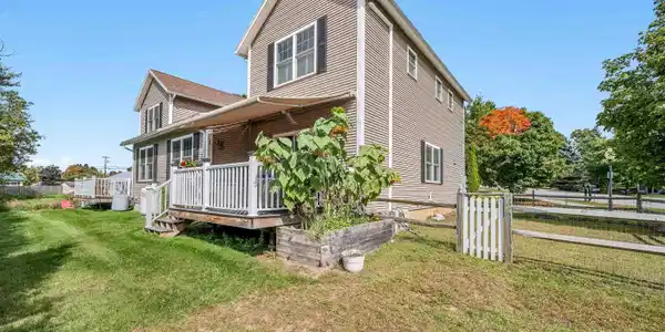 Image 2: Back deck with awning and raised beds!