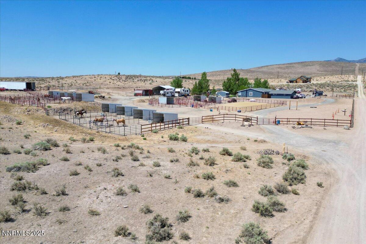 Image 3: Drone low from horses and stables
