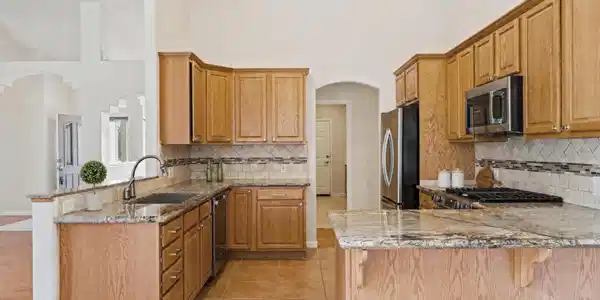 Image 3: A7V00215_kitchen_staged_v1_virtually_sta