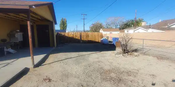Image 4: 104 F st side yard parking