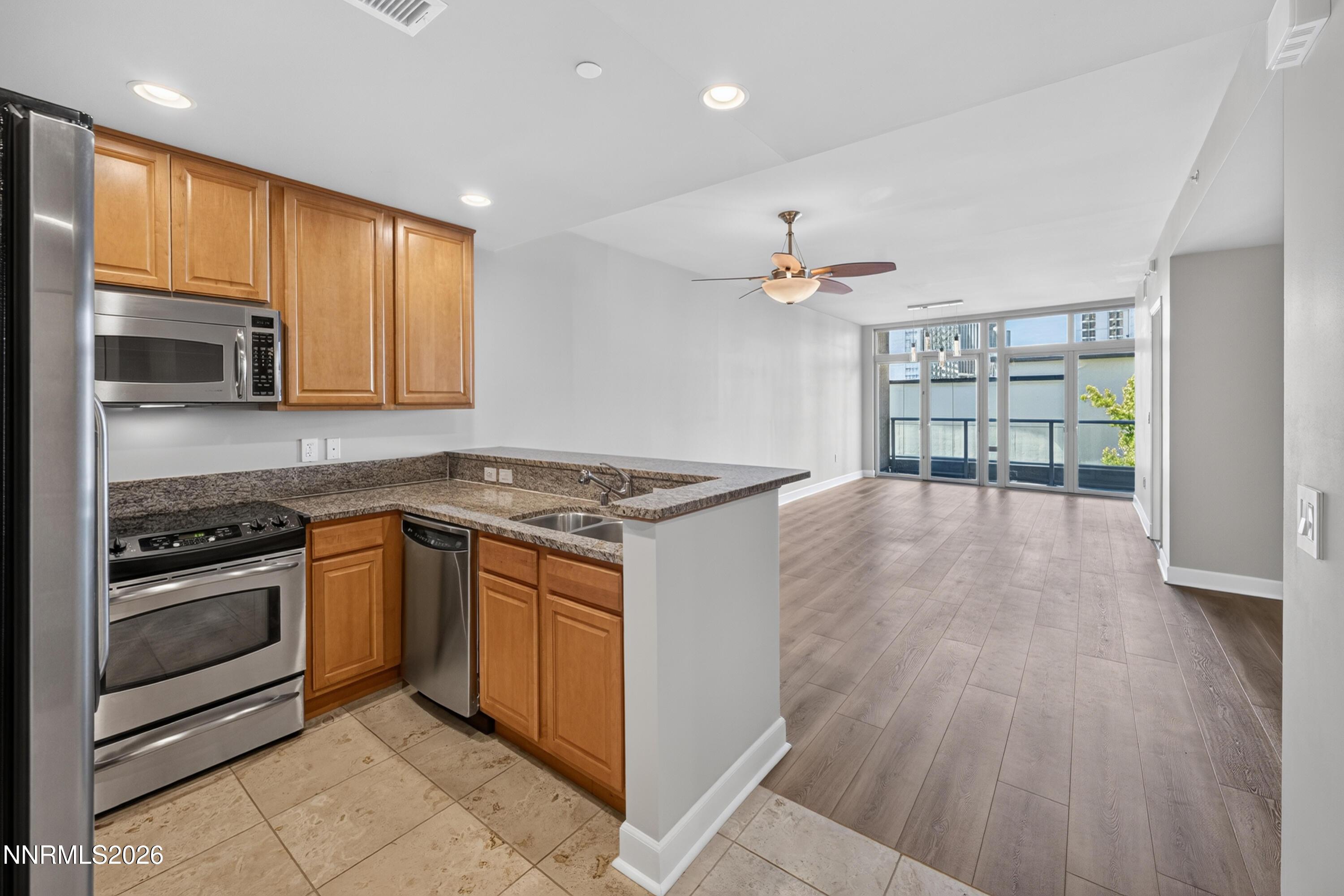 Image 1: Open kitchen and living area
