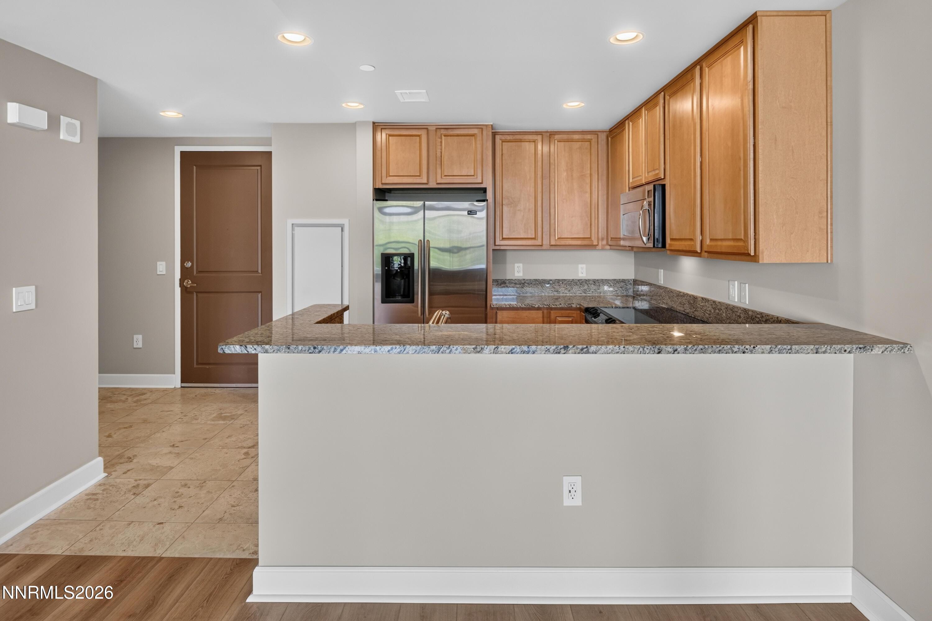 Image 2: Kitchen with island and appliances