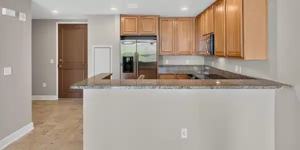 Image 2: Kitchen with island and appliances