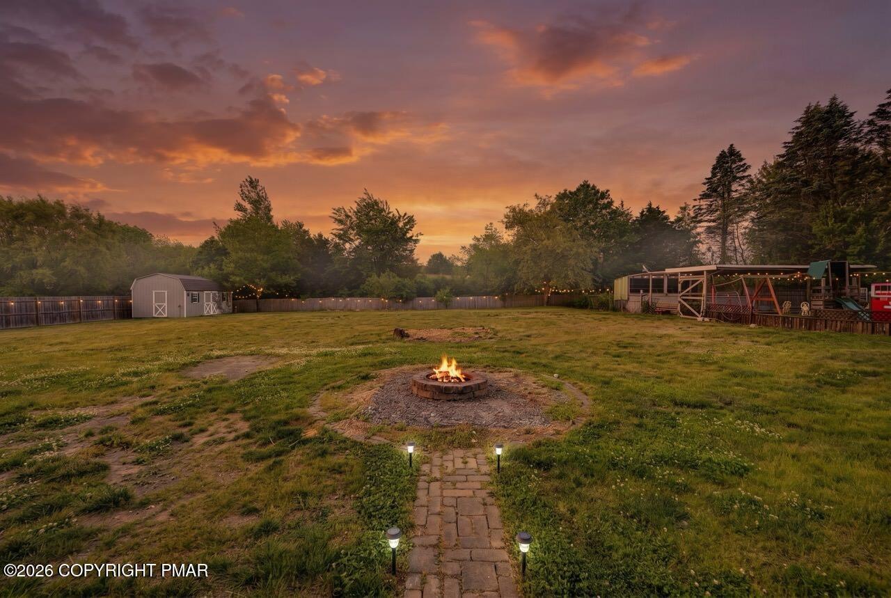 Image 4: Expansive Yard Space w/ Fire Pit