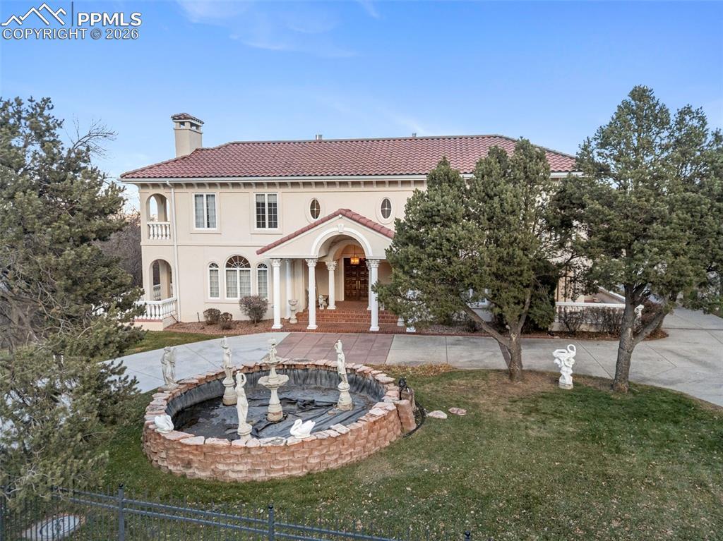 Image 1: front of Home with Water foutain