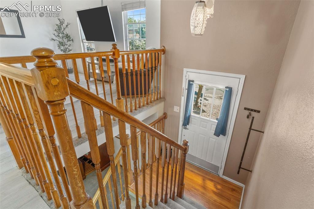 Image 4: Staircase featuring wood finished floors and baseboards