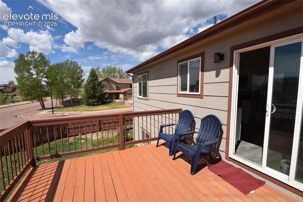 Image 3: Expansive wood deck with a full railing system