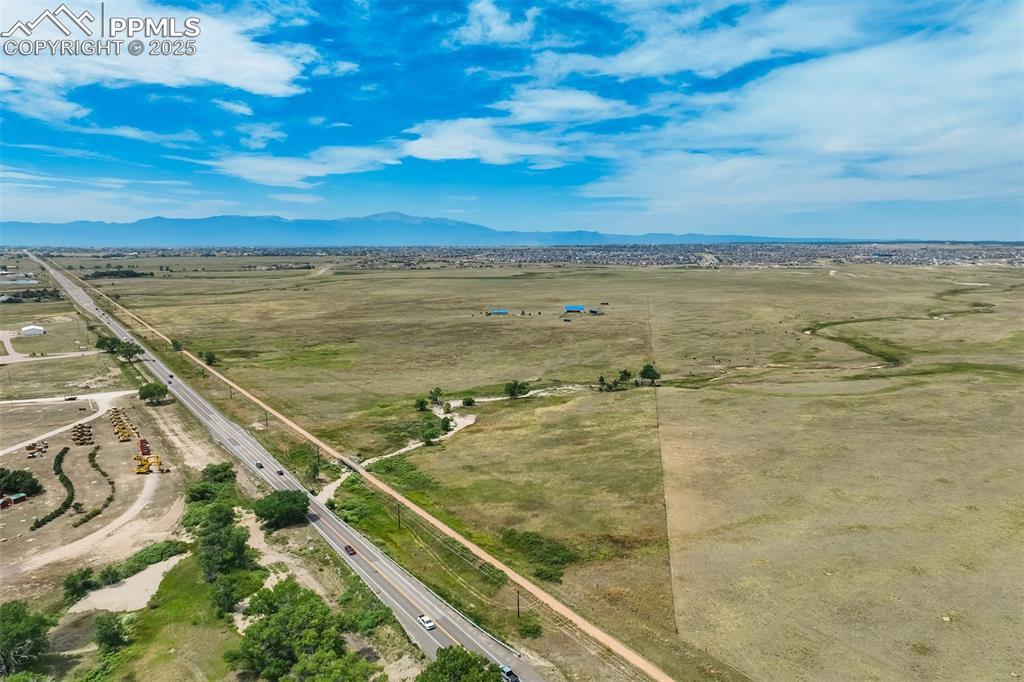 Image 3: View of rural area with mountains