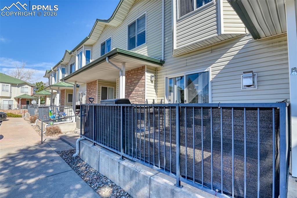 Image 2: View of side of property with brick siding