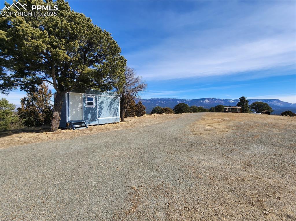 Image 3: View of dirt / gravel road featuring a mountain view