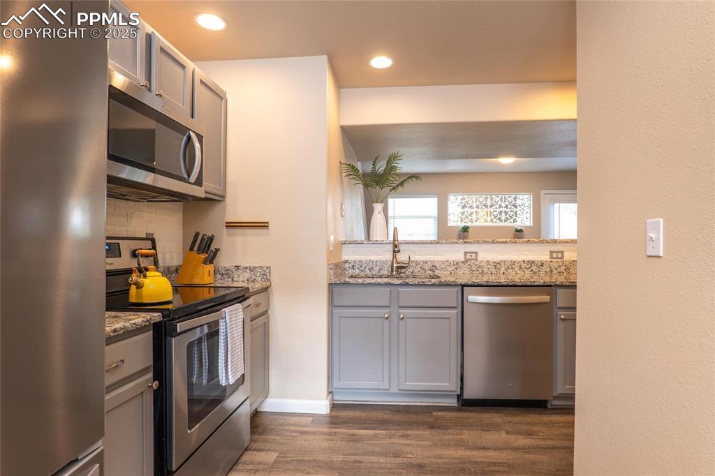 Image 4: Kitchen opens to the family room.