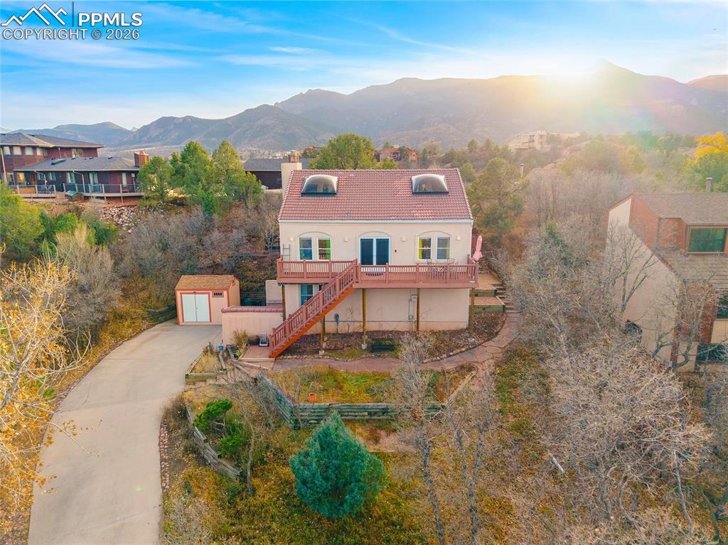 Image 4: Front of home with the Front Range and Pike's Peak in the background.