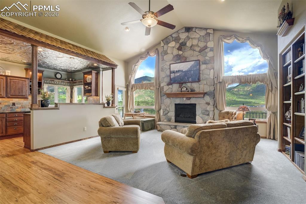 Image 4: Vaulted Great Room on the main level with stunning mountain and valley views