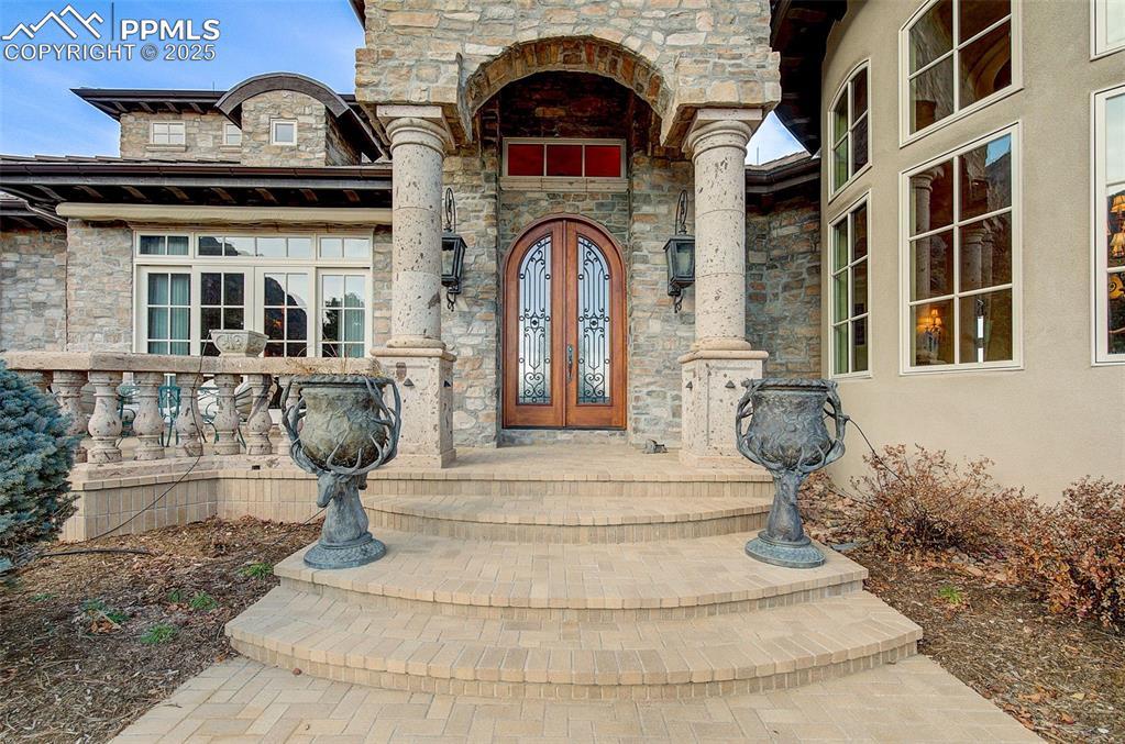 Image 3: Custom Front Doors Are Accented By Oversized Gas Lights.