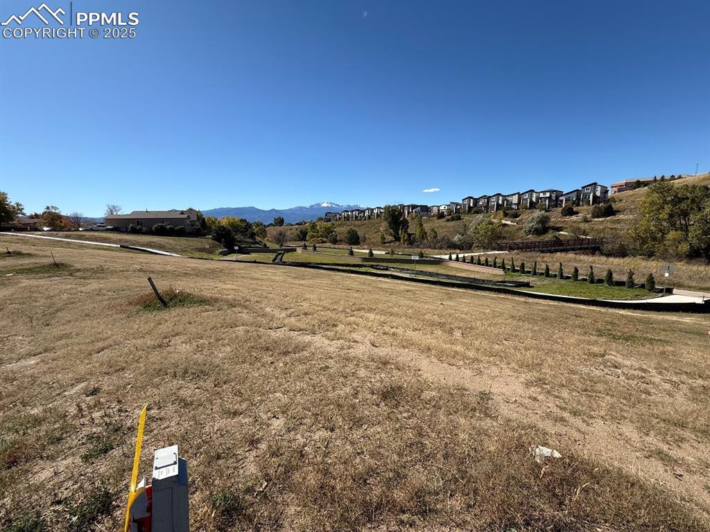 Image 3: View of mountain background featuring rural landscape