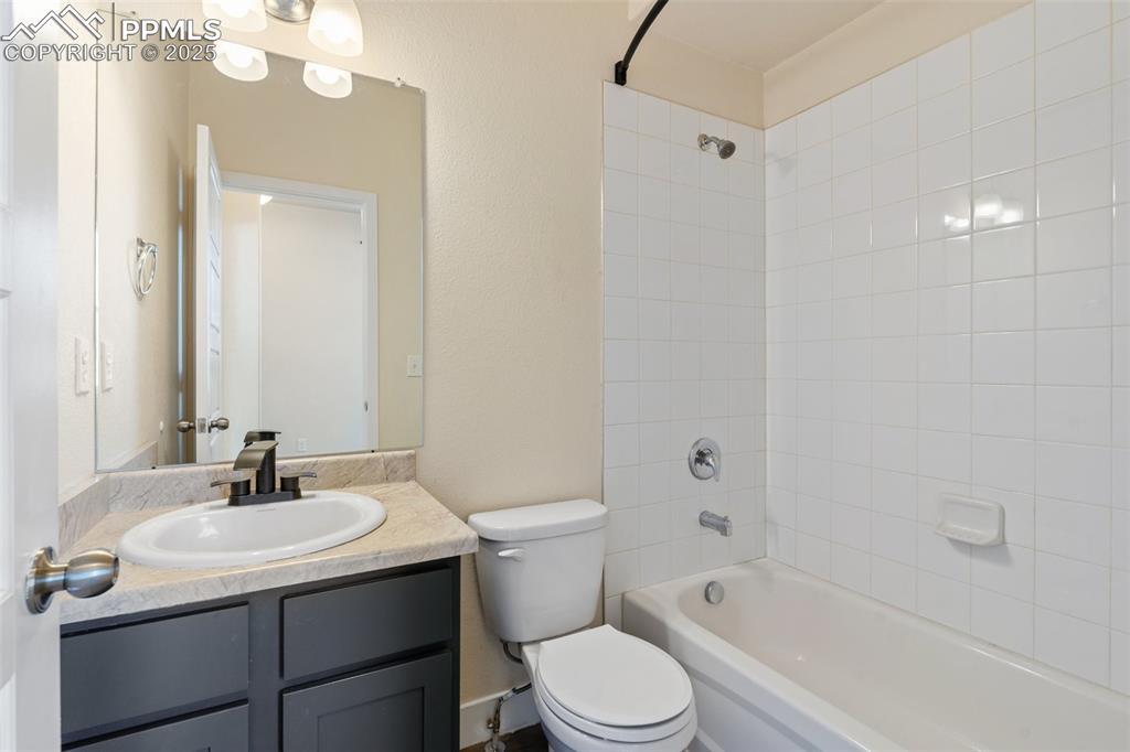 Image 3: Full bathroom with vanity and shower / bathtub combination