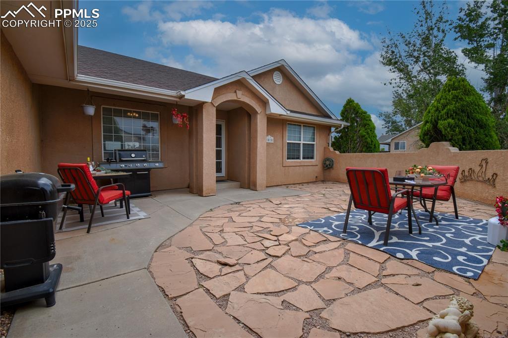 Image 4: View of patio featuring outdoor dining space