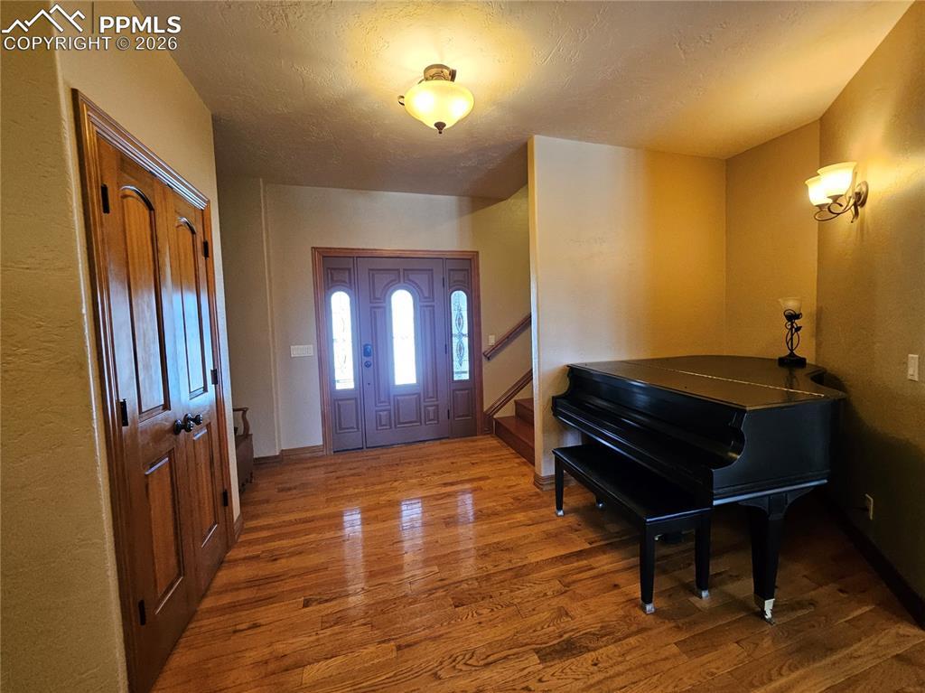 Image 3: Foyer with wood finished floors