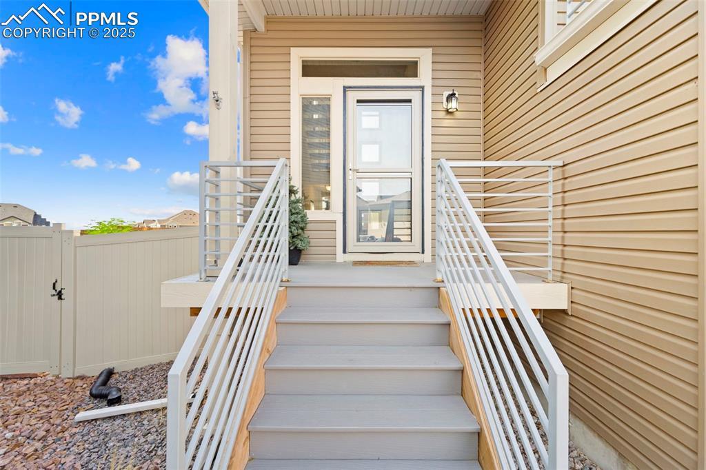 Image 4: View of exterior entry with a gate