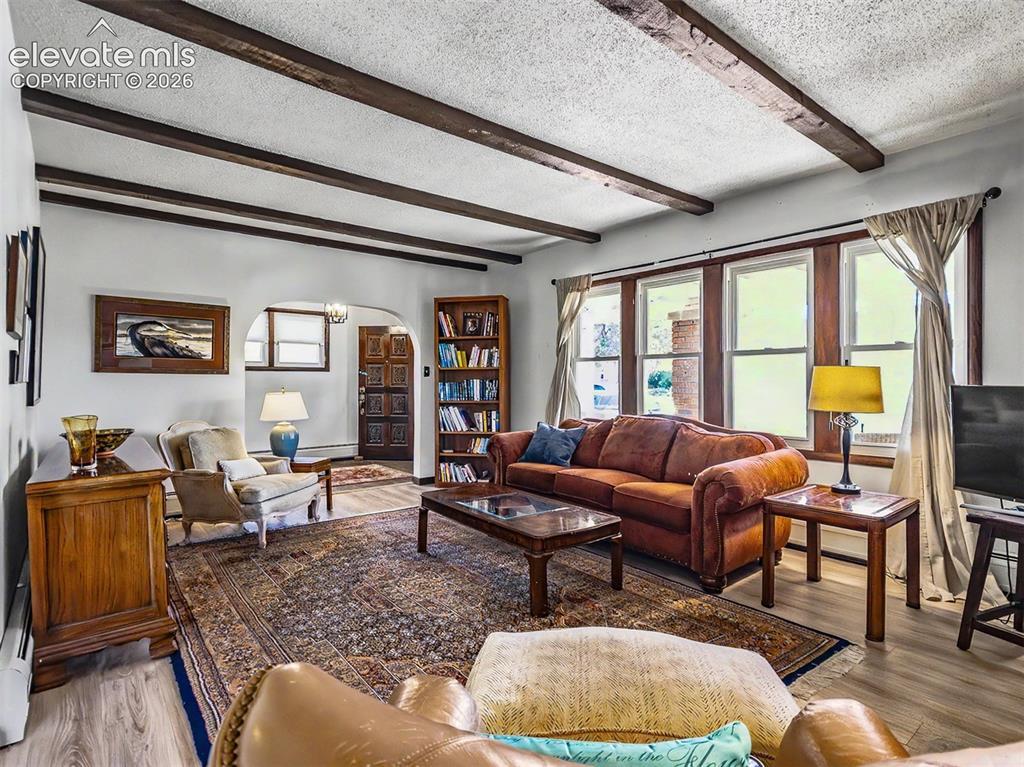 Image 2: With Fireplace, Built-Ins and spacious entry off of screened porch.