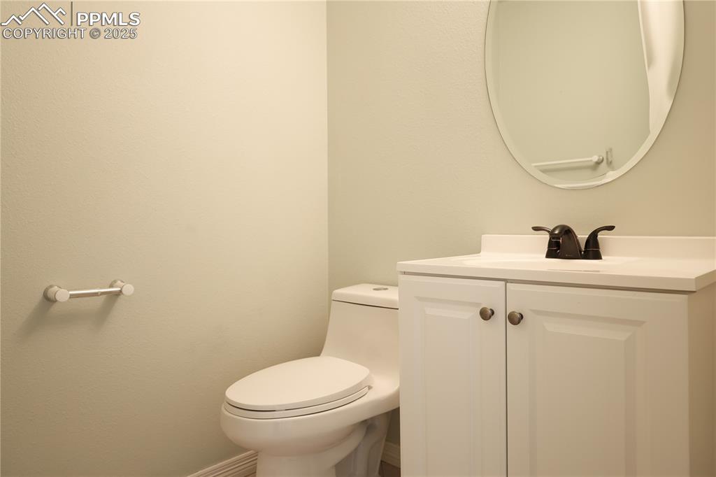 Image 3: Bathroom with vanity on main level.