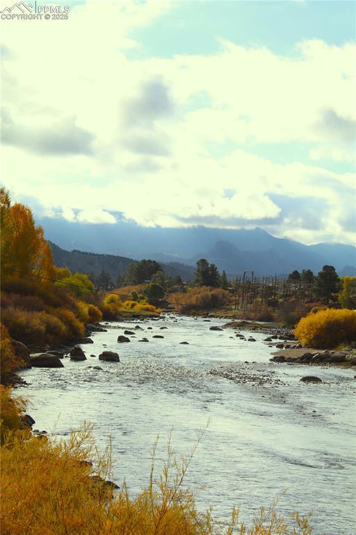 Image 2: Water view featuring a mountainous background