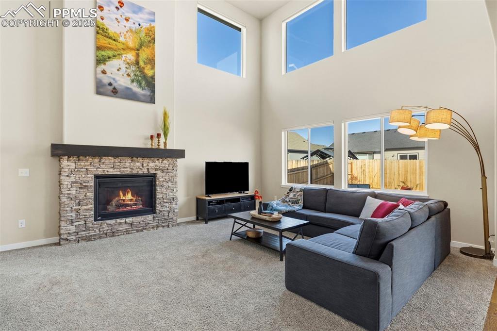 Image 2: Great Room has Fireplace and Soaring Ceilings!