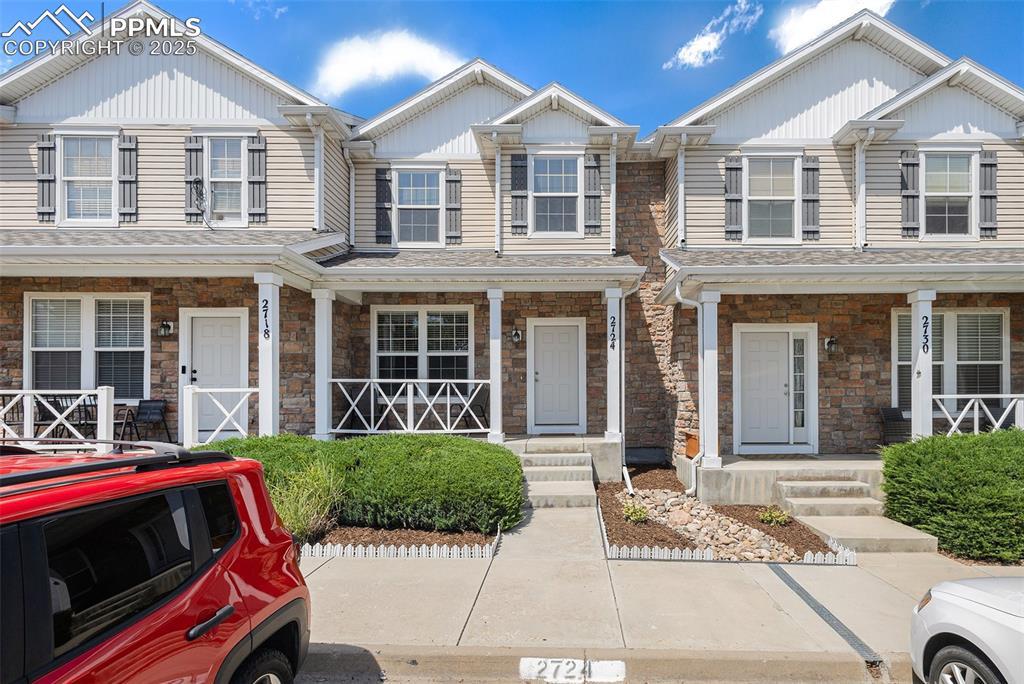 Image 1: Craftsman-style home featuring a porch and stone siding