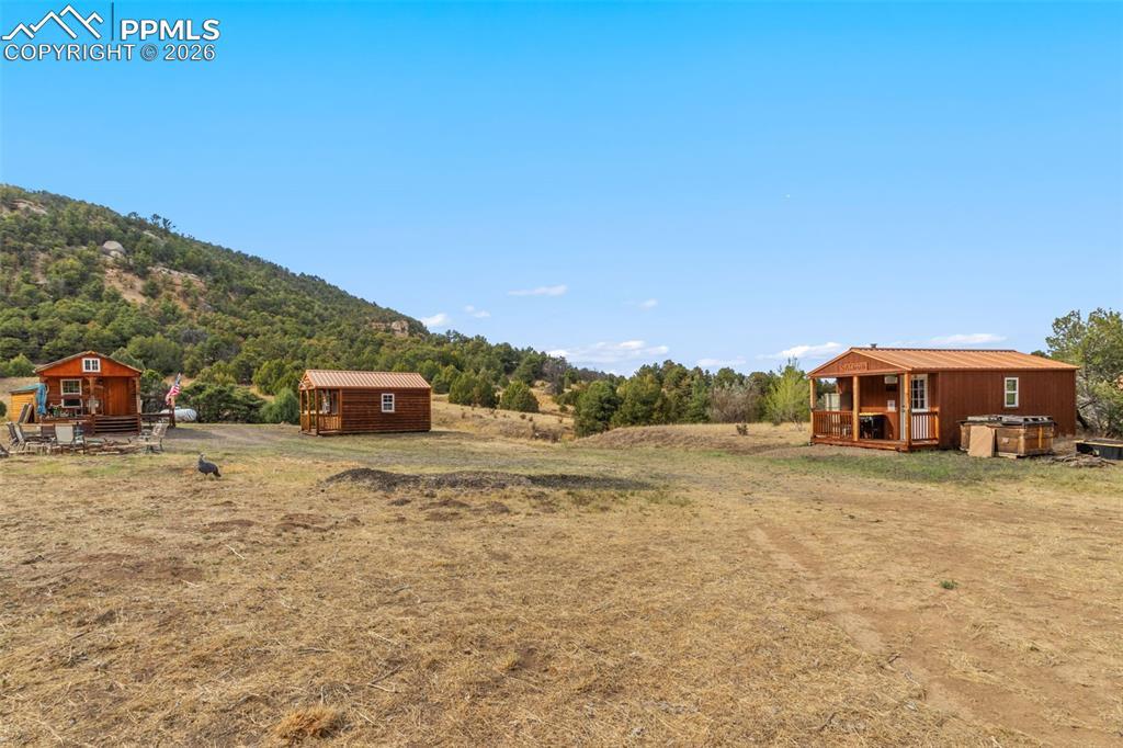 Image 2: From left to right...log cabin, bunkhouse cabin, and saloon cabin.