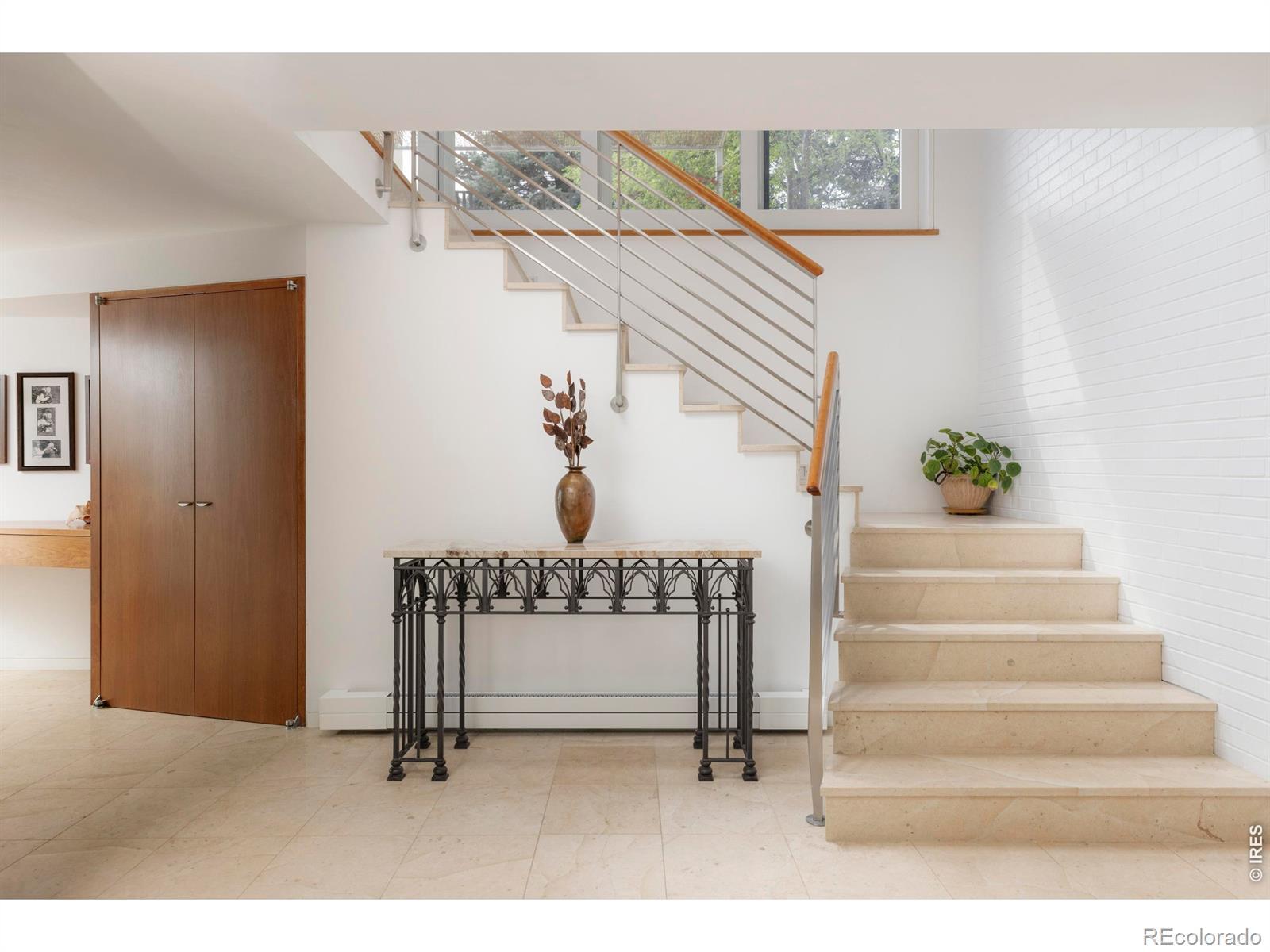 Image 4: The home today was designed with a European sensibility woven through every detail: the covered entry porch, the custom woodwork, the perimeter lighting, the built-in shelving that runs through room after room. Image 4: The home today was designed with a European sensibility woven through every detail: the covered entry porch, the custom woodwork, the perimeter lighting, the built-in shelving that runs through room after room.