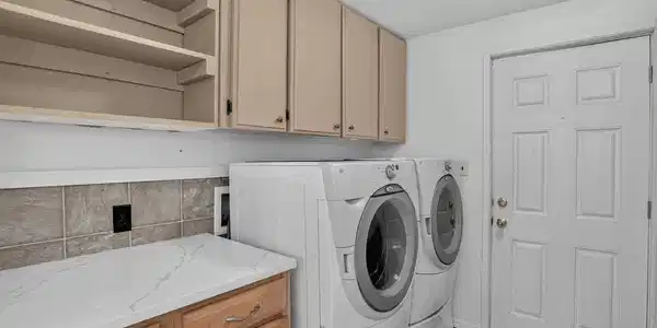 Image 3: Entry with Clothes Washer and Dryer