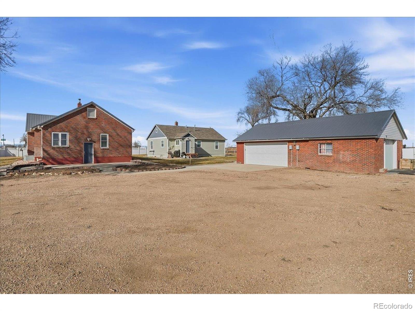 Image 3: Brick home and brick garage are on the same parcel. The green house in the back ground is a separate parcel with an address of 33076 County Road 43-also listed for sale! Image 3: Brick home and brick garage are on the same parcel. The green house in the back ground is a separate parcel with an address of 33076 County Road 43-also listed for sale!