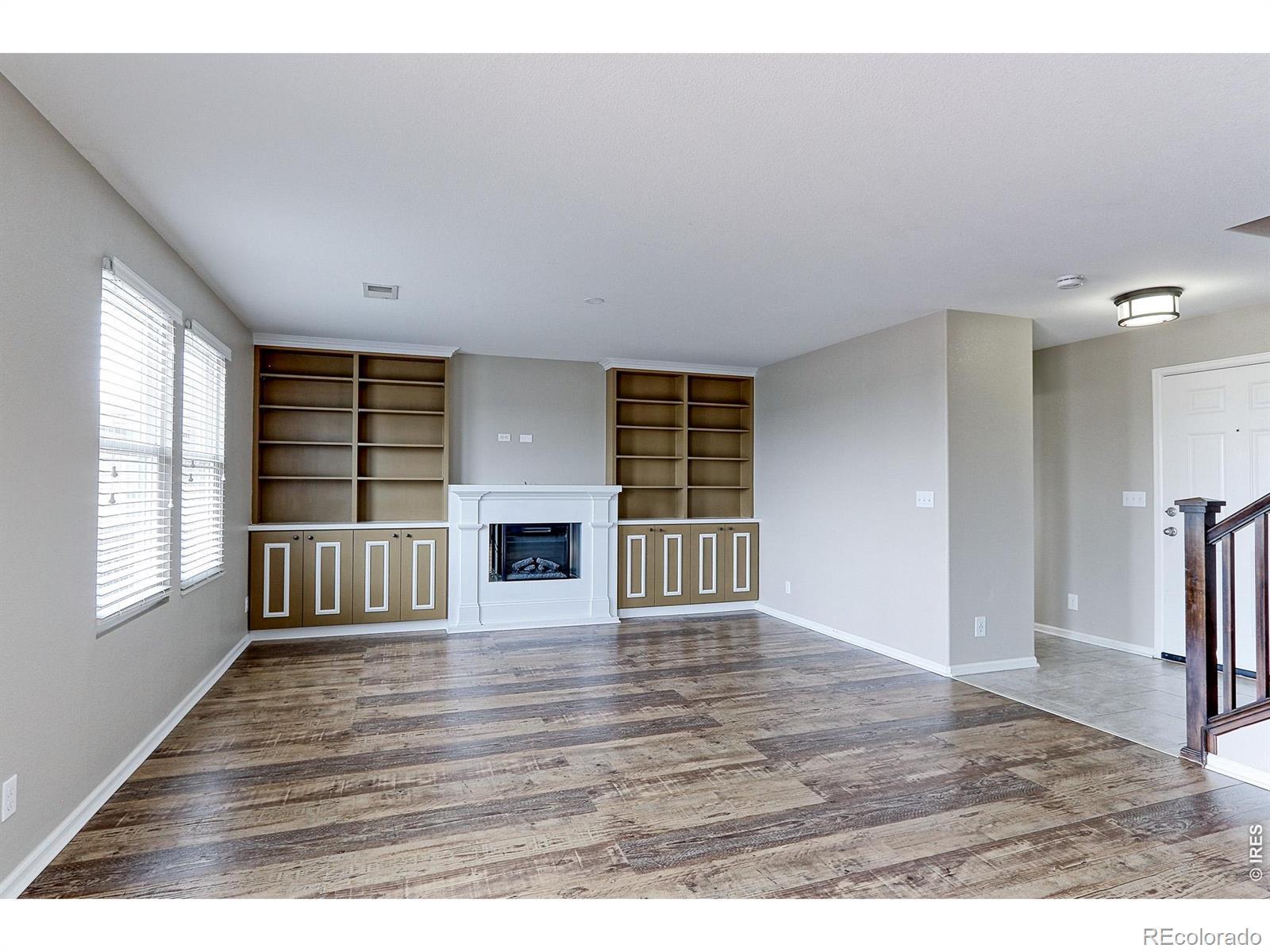 Image 2: This 15x15 family room is very bright, and features, beautiful new LVP plank water and scratch resistant floors, custom built-in shelving and entertainment center with Spectra fire, electric fireplace, with remote start. Image 2: This 15x15 family room is very bright, and features, beautiful new LVP plank water and scratch resistant floors, custom built-in shelving and entertainment center with Spectra fire, electric fireplace, with remote start.