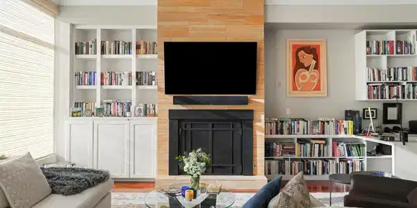 Image 3: Custom built-in shelving and cabinetry add functionality and design to the updated living room. Image 3: Custom built-in shelving and cabinetry add functionality and design to the updated living room.
