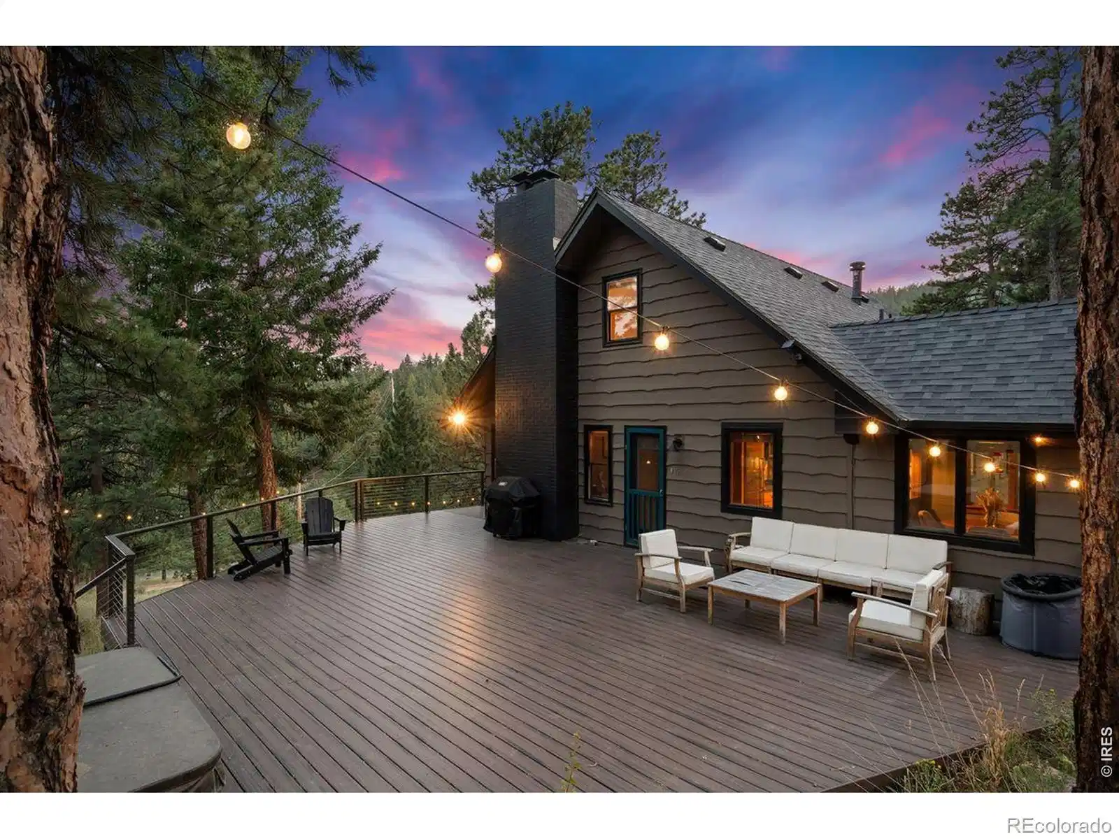 Image 1: Expansive 900 square foot deck that wraps around to the front of the home. Image 1: Expansive 900 square foot deck that wraps around to the front of the home.