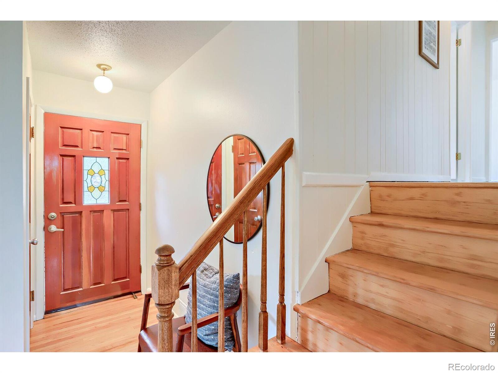 Image 4: Front Entry. A coat closet is conveniently located at the entrance and the stairs take you to the upper level bedrooms and full bath.