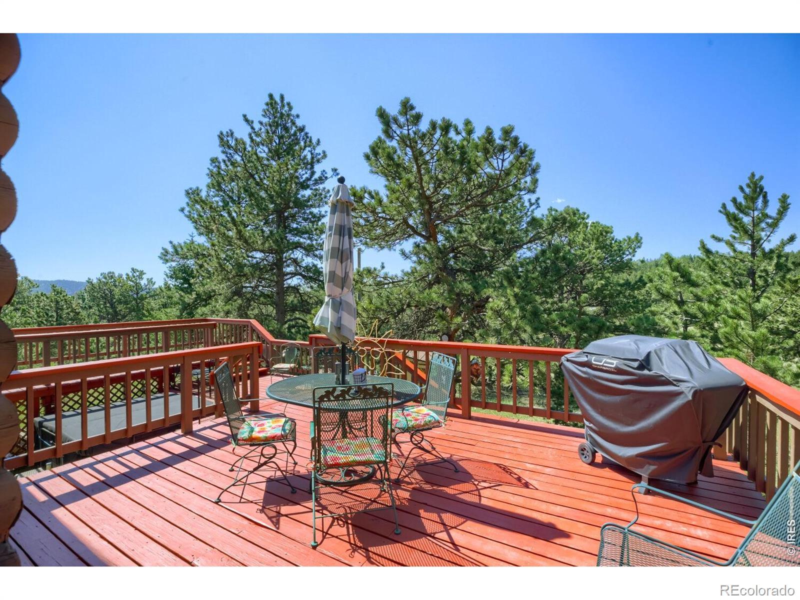 Image 3: Wrap-around decking offers loads of outdoor space to soak in the sunshine and enjoy the fresh mountain air.