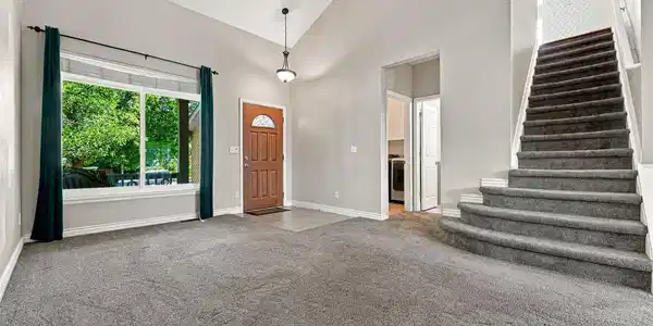 Image 4: Main Entry into living room with vaulted ceilings. Image 4: Main Entry into living room with vaulted ceilings.
