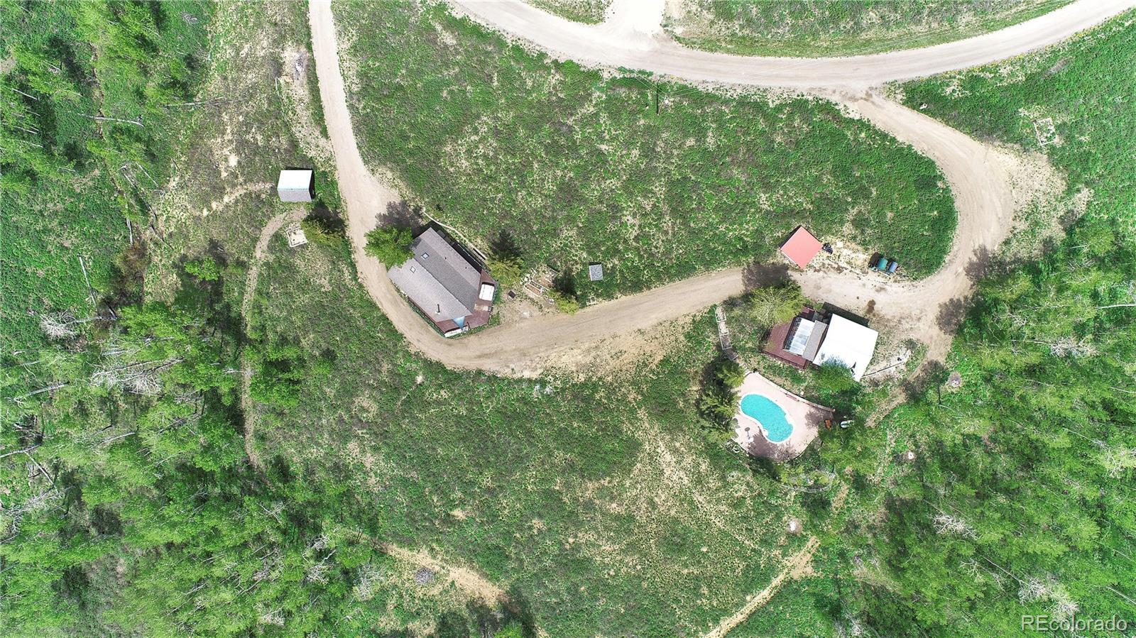Image 2: Aerial - In-ground pool - virtually staged with water