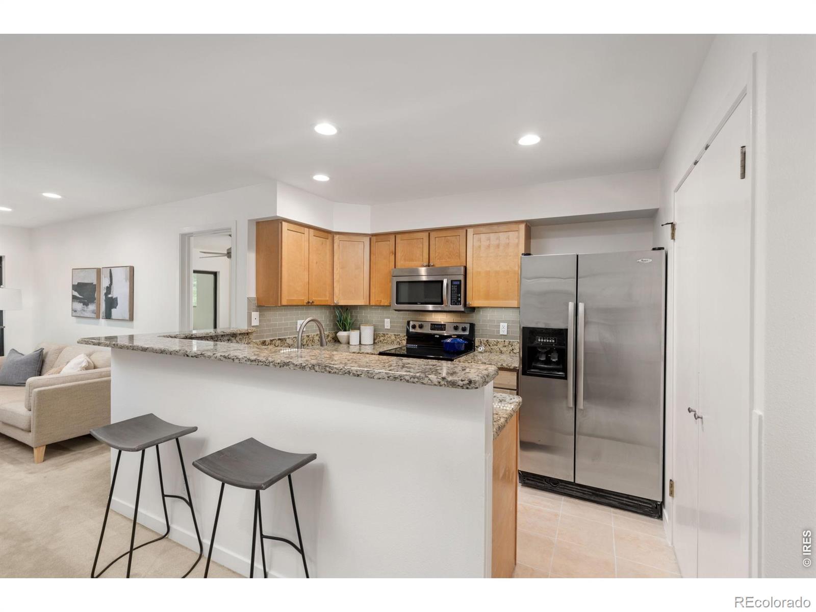 Image 2: Kitchen with available bar seating Image 2: Kitchen with available bar seating