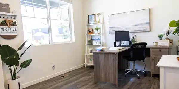 Image 4: Main Floor Flex Room: Versatile space ideal for a home office, guest suite, or main-level bedroom. Image 4: Main Floor Flex Room: Versatile space ideal for a home office, guest suite, or main-level bedroom.