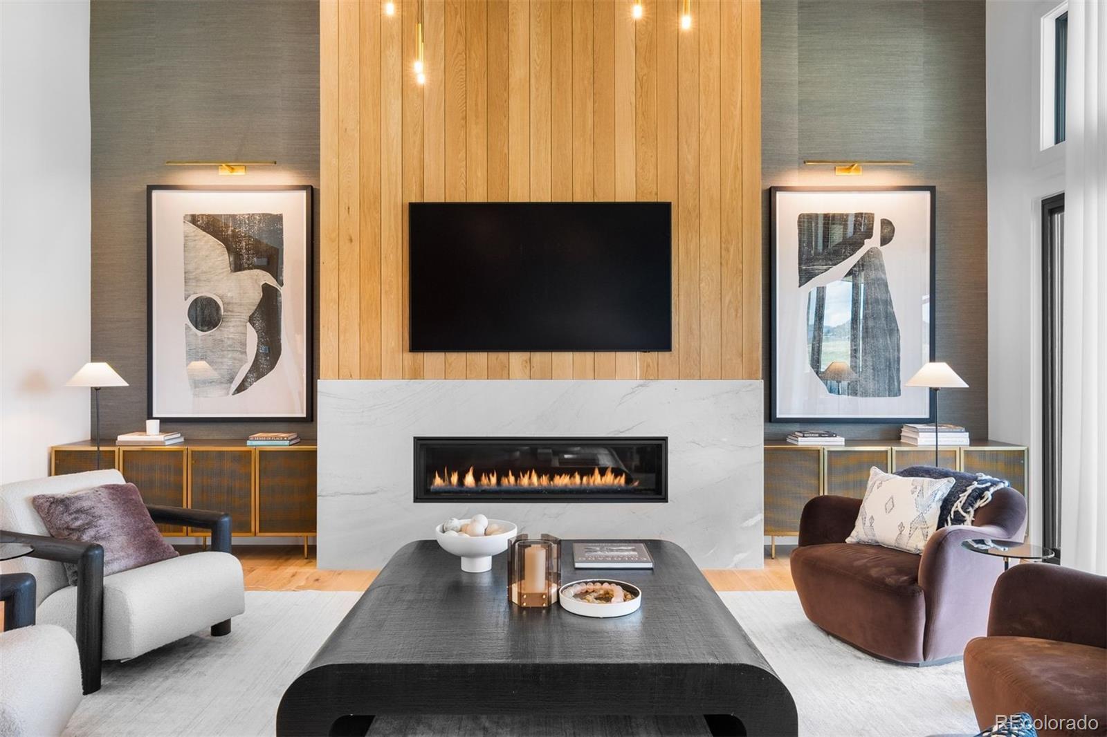 Image 2: White oak and marble fireplace surround creating a refined focal point. Image 2: White oak and marble fireplace surround creating a refined focal point.