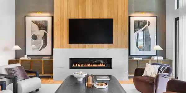 Image 2: White oak and marble fireplace surround creating a refined focal point.