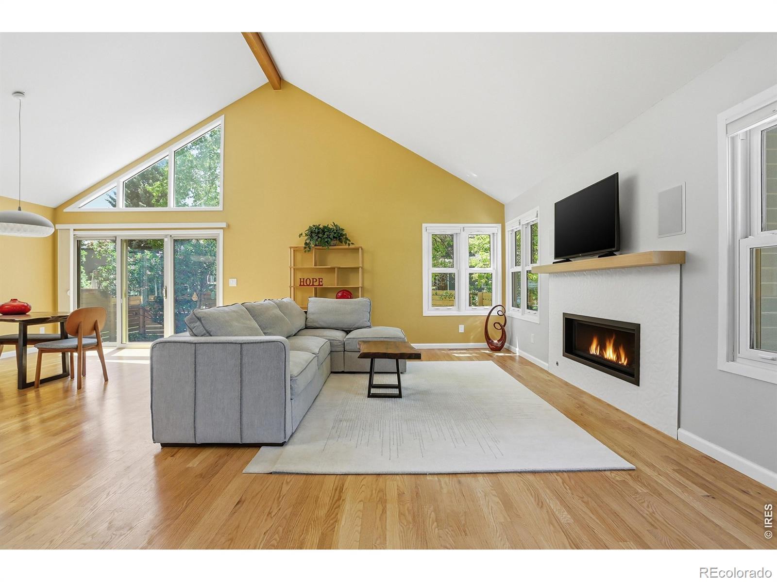 Image 2: Soaring ceilings, abundant natural light, and a warm fireplace create an inviting space that captures the openness and flow of the home. Image 2: Soaring ceilings, abundant natural light, and a warm fireplace create an inviting space that captures the openness and flow of the home.