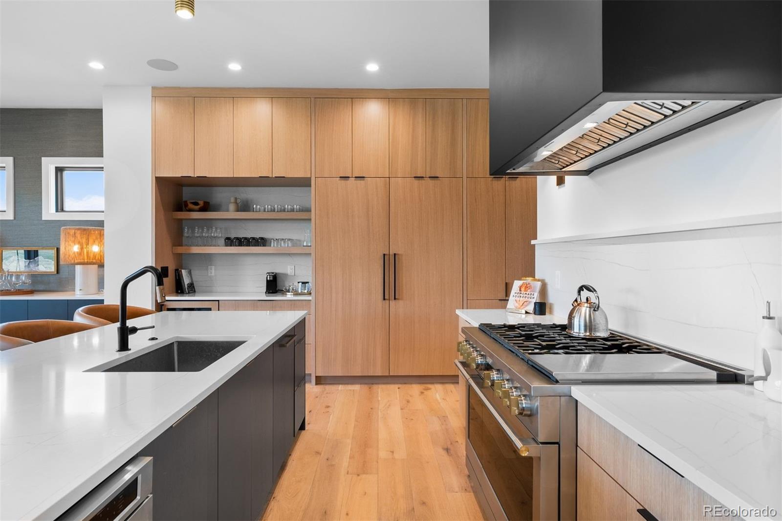 Image 4: Monogram range framed by white oak cabinetry and clean-lined finishes. Image 4: Monogram range framed by white oak cabinetry and clean-lined finishes.