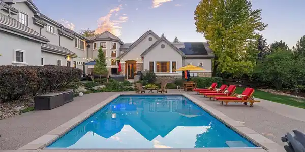 Image 2: Backyard oasis with swimming pool, terraced entertaining and living spaces, and expansive gardens Image 2: Backyard oasis with swimming pool, terraced entertaining and living spaces, and expansive gardens